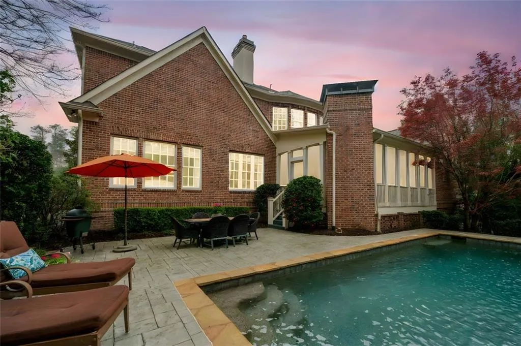 Twilight of Pool and Rear of Home