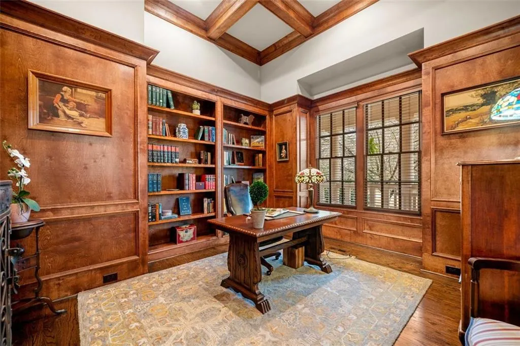 Wood Paneled Executive Office with Built-ins Looking out at Front Yard