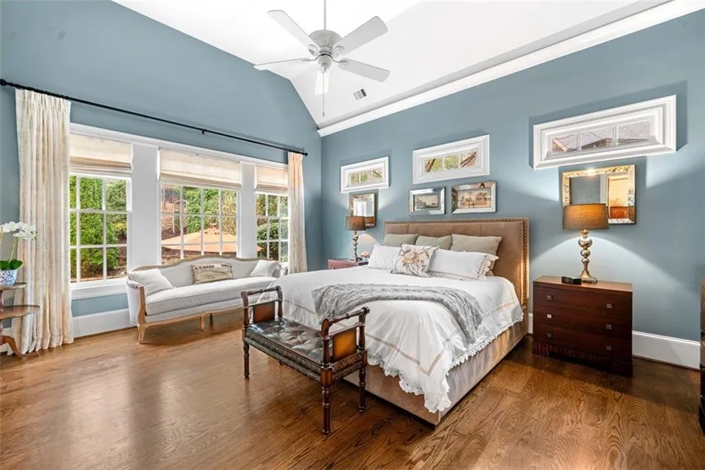 Primary Suite with Wall of Windows Overlooking the Private Heated Pool