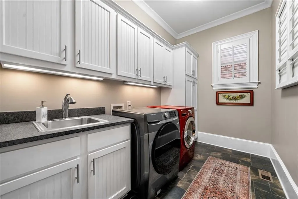 Laundry room on Main Level with Sink and Slew of Storage (2nd Laundry Room Upstairs)