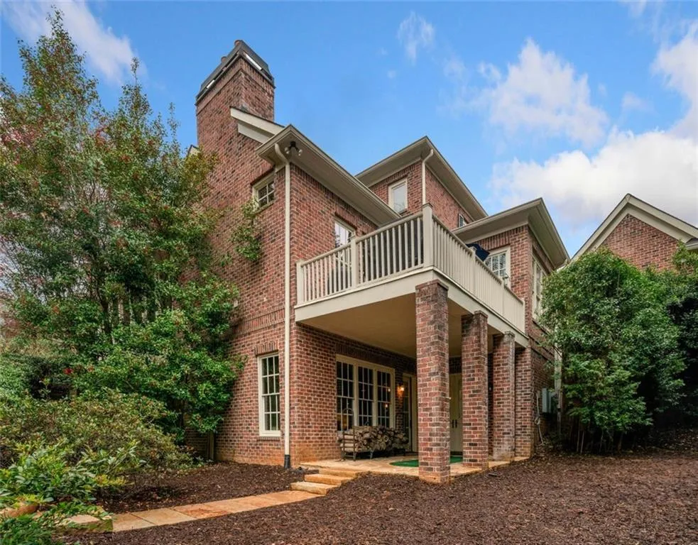 Side of Home - Covered Area off Terrace Level and Above Featuring Grill Patio off Kitchen