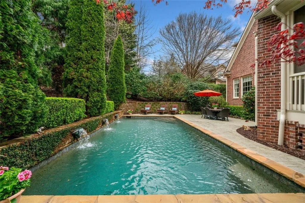 Heated Saltwater Pool with Water Features Provides Serene and Private Setting