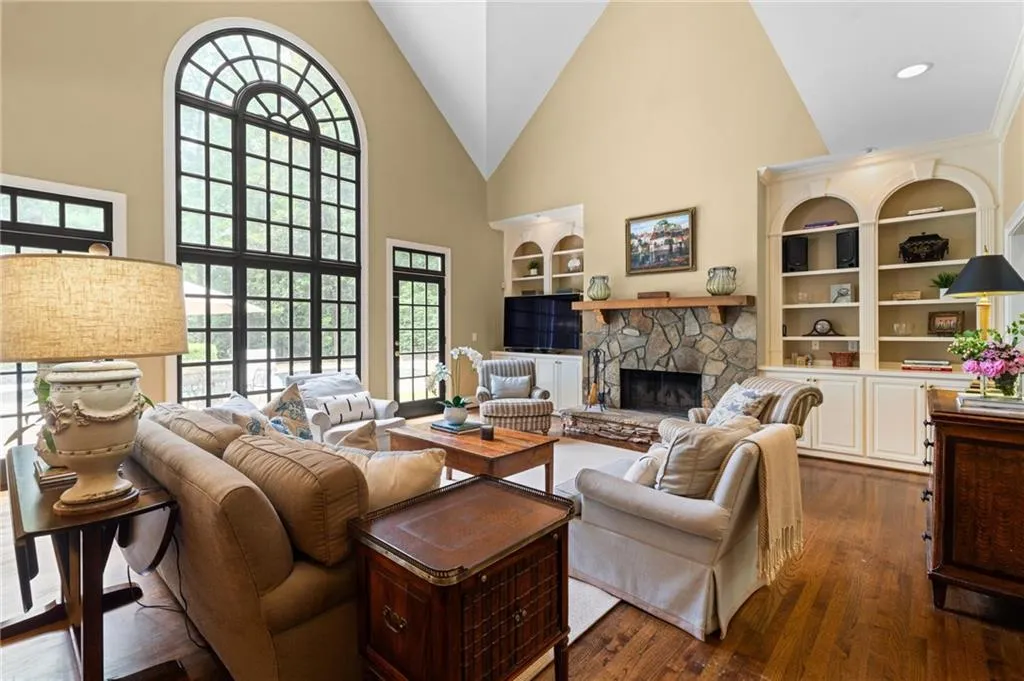 Generous fireside family room with vaulted ceiling.