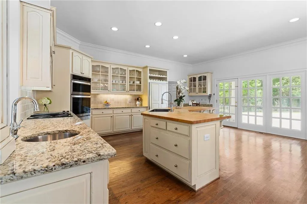 You can enter the kitchen from a covered walkway to the wrap around porch from the detached garage.