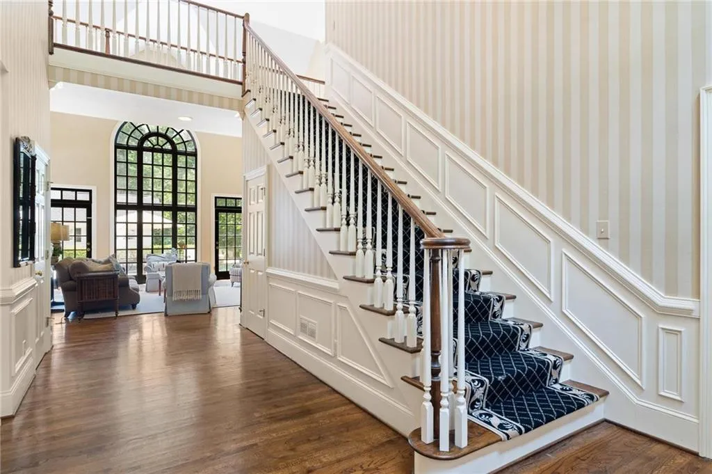 Gracious 2-story entry foyer with dining room to the left, study to the right and family room ahead.