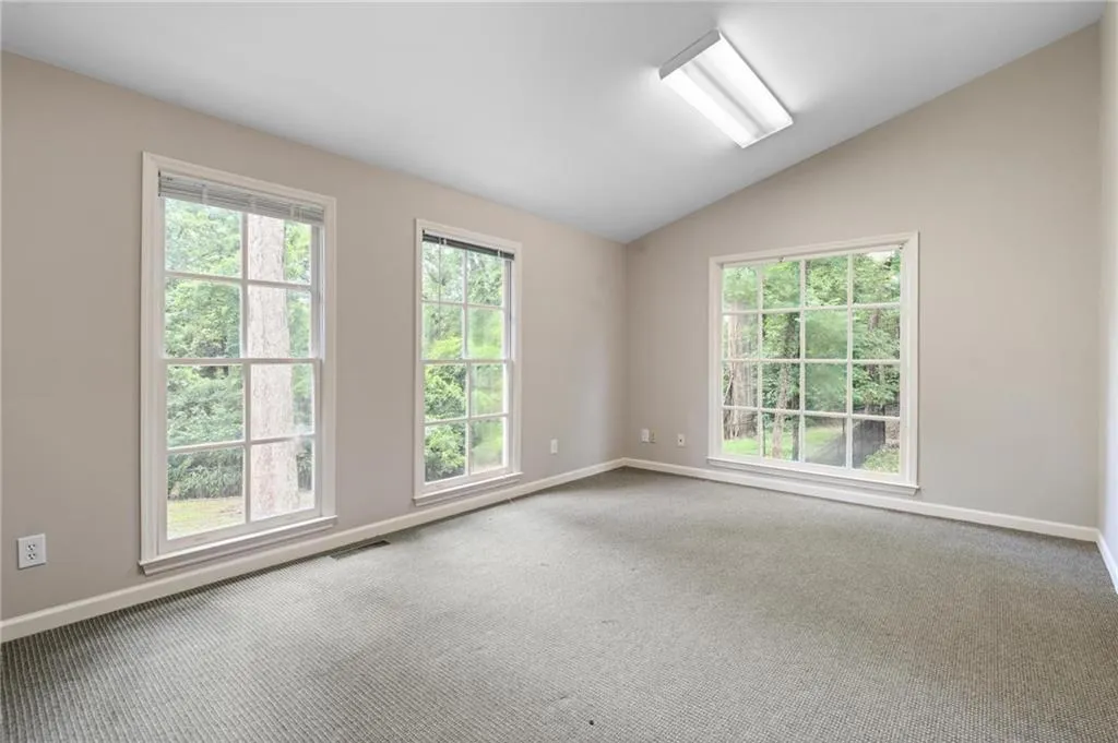 Large family room/3rd bedroom/office in guest house.
