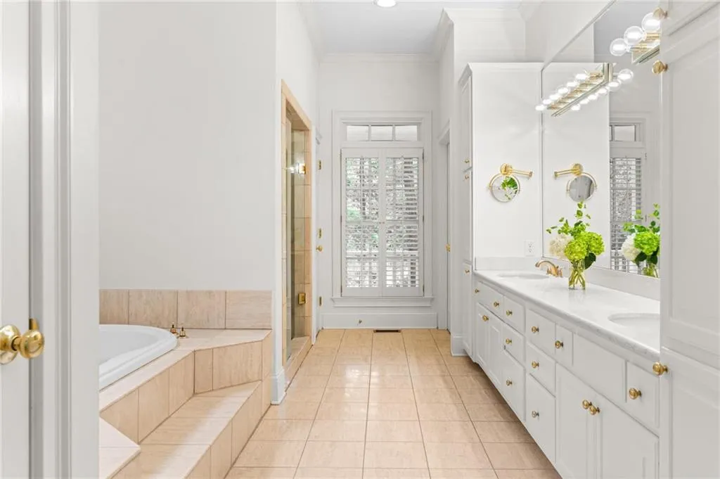 Primary bath with his and her closets