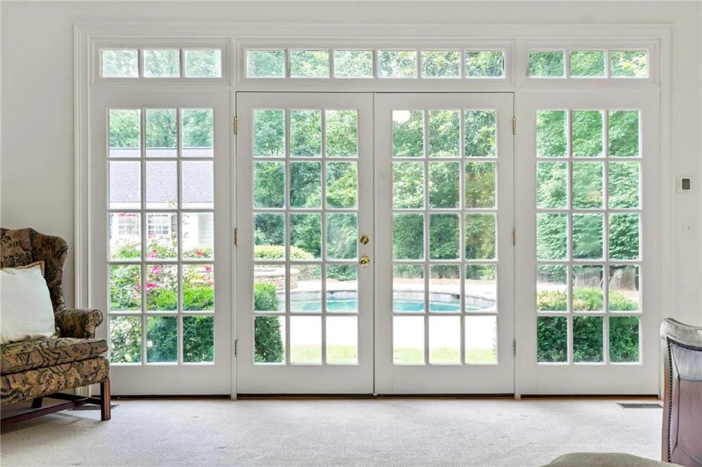 Primary bedroom opens to back yard and pool
