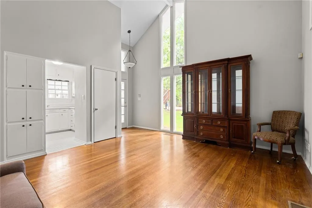 Upon entering the guest house, there is a large family room with vaulted ceiling.