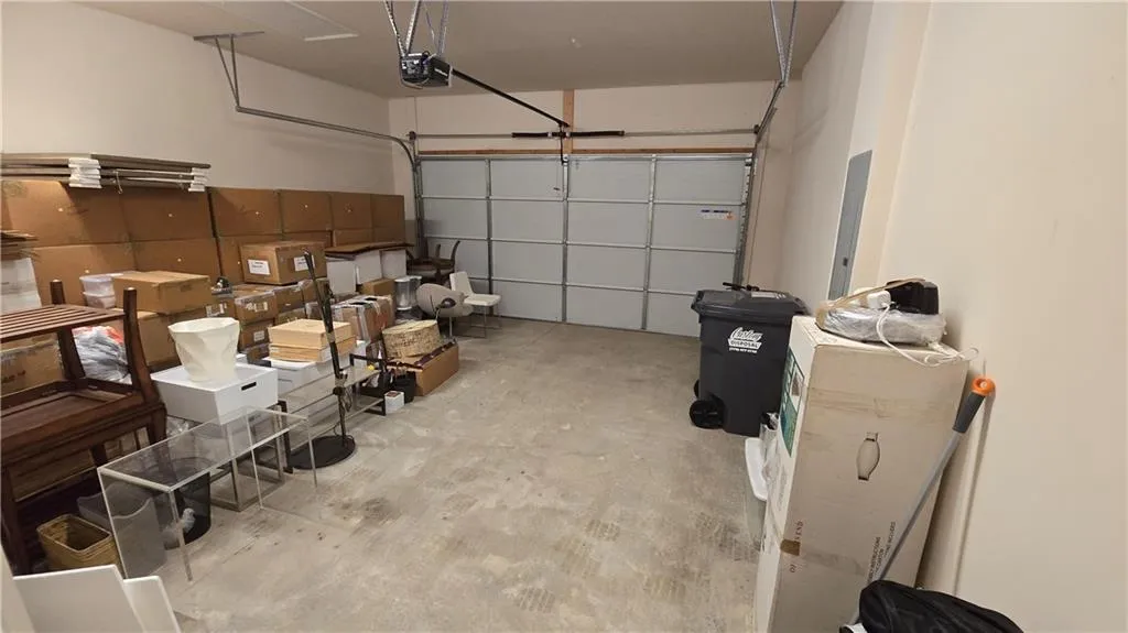 Garage featuring a garage door opener