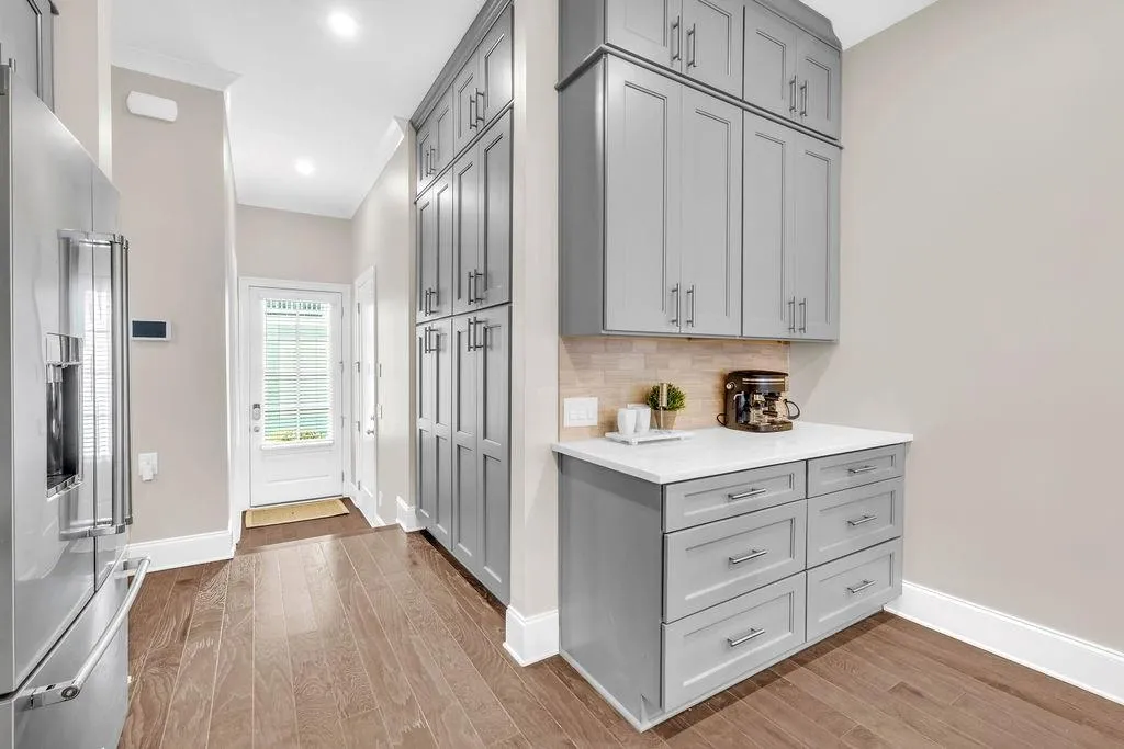 Mudroom area, built-in pantry & coffee bar area