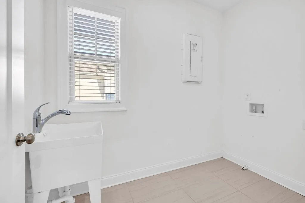 Upstairs laundry with sink