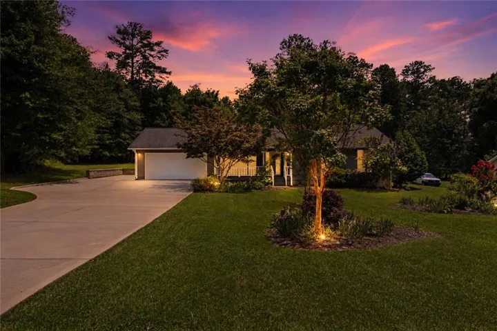 Single-story residence featuring a two-car garage with an automatic door