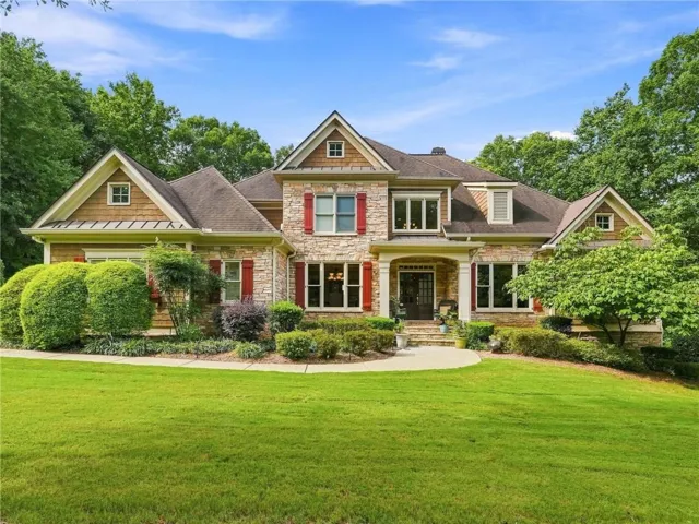 Stone and shingle exterior with gabled roof lines