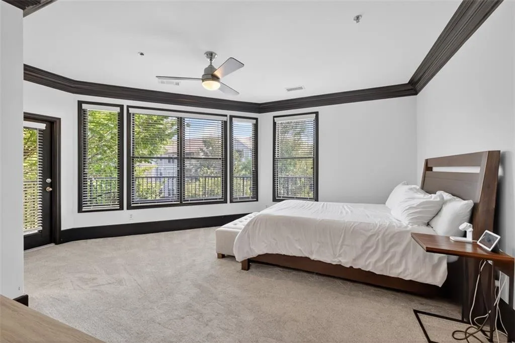 Bedroom with carpet, crown molding, access to outside, and a ceiling fan