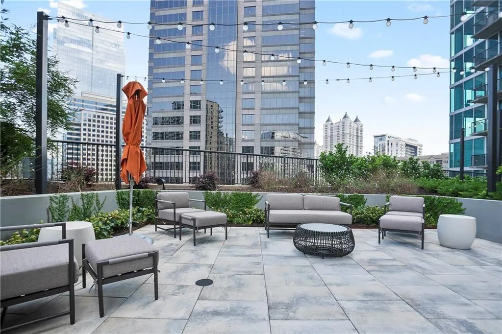 View of patio with a city view and an outdoor living space