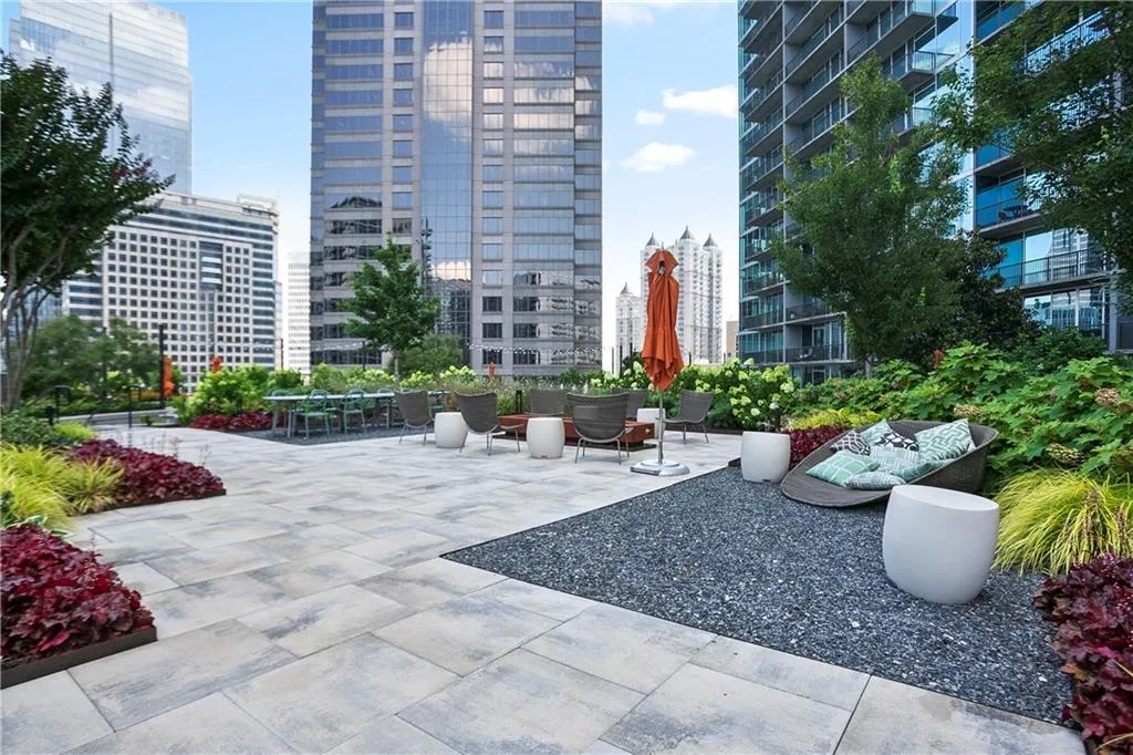 View of community with a view of city and a patio area