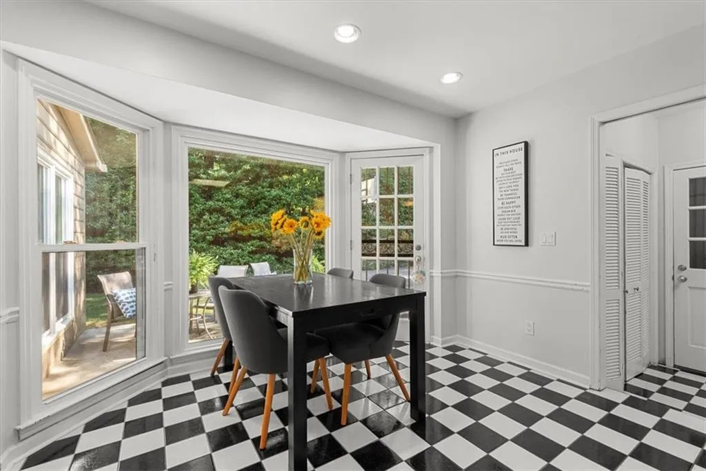 Breakfast room with a healthy amount of sunlight and tile flooring