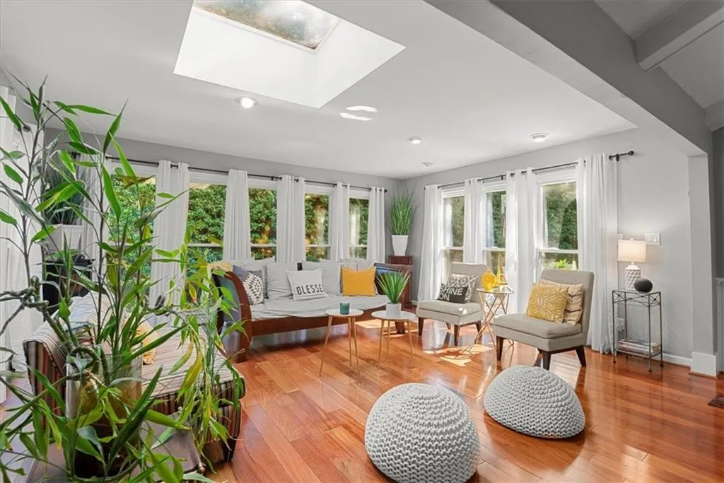 Sunroom featuring a skylight