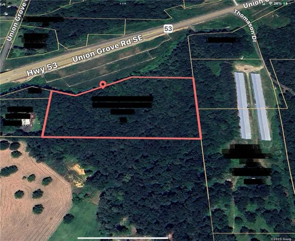 Aerial map of property and surrounding area with property parcel outlined