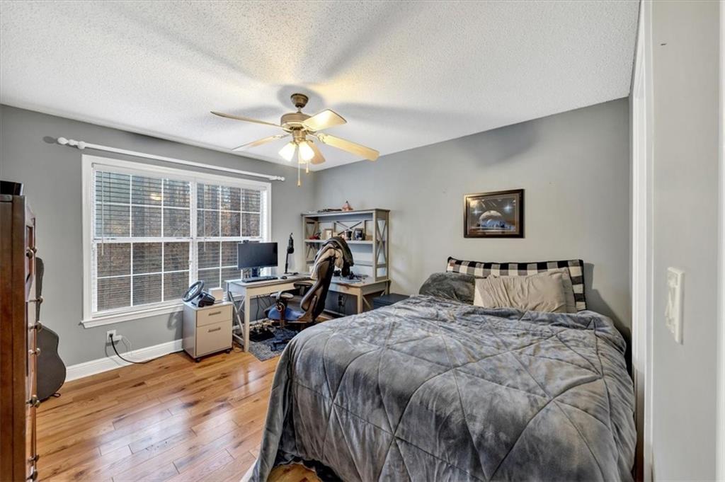 Bright and airy second bedroom or office with attached bathroom and walk in closet!