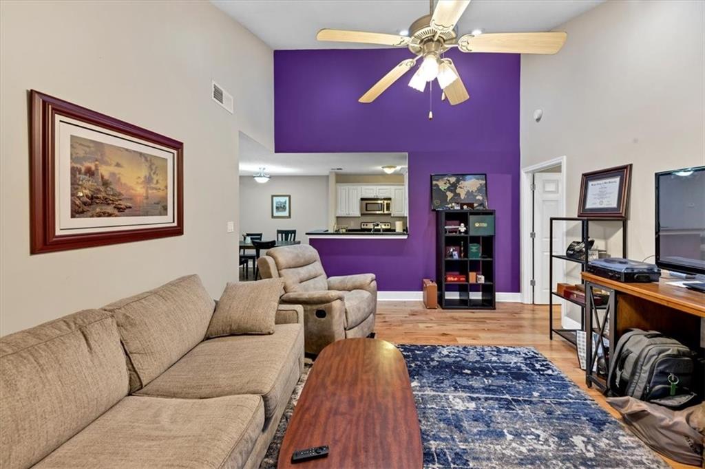 View from living room to kitchen with statement accent wall