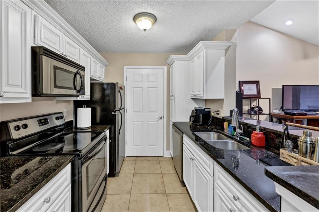 White cabinets, and granite counters, and stainless steel appliances!