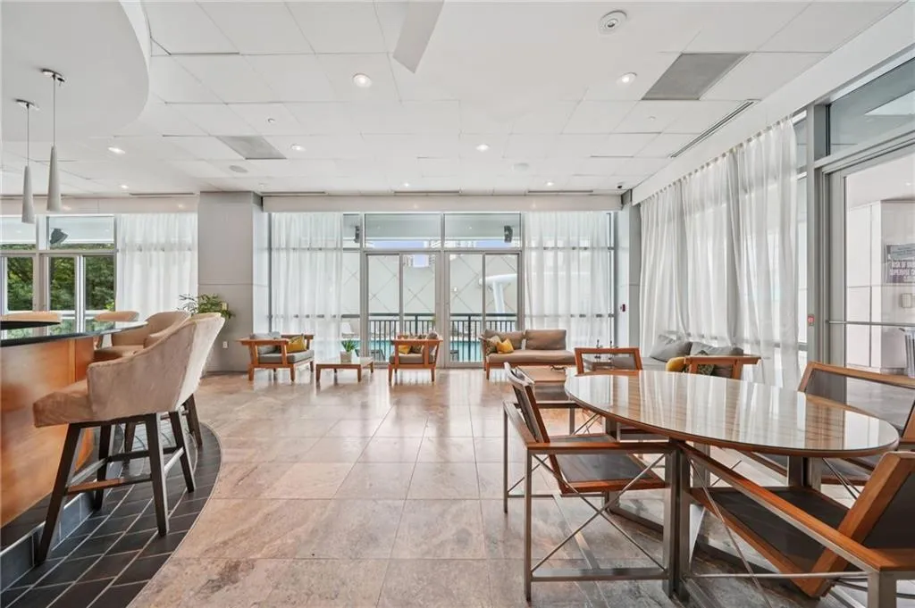 Dining area featuring a drop ceiling and recessed lighting