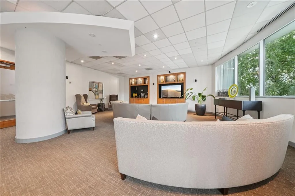Community lobby featuring recessed lighting and a drop ceiling