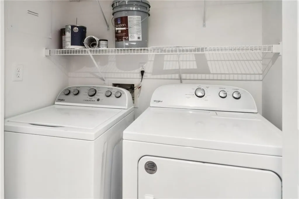 Laundry room with washing machine and clothes dryer