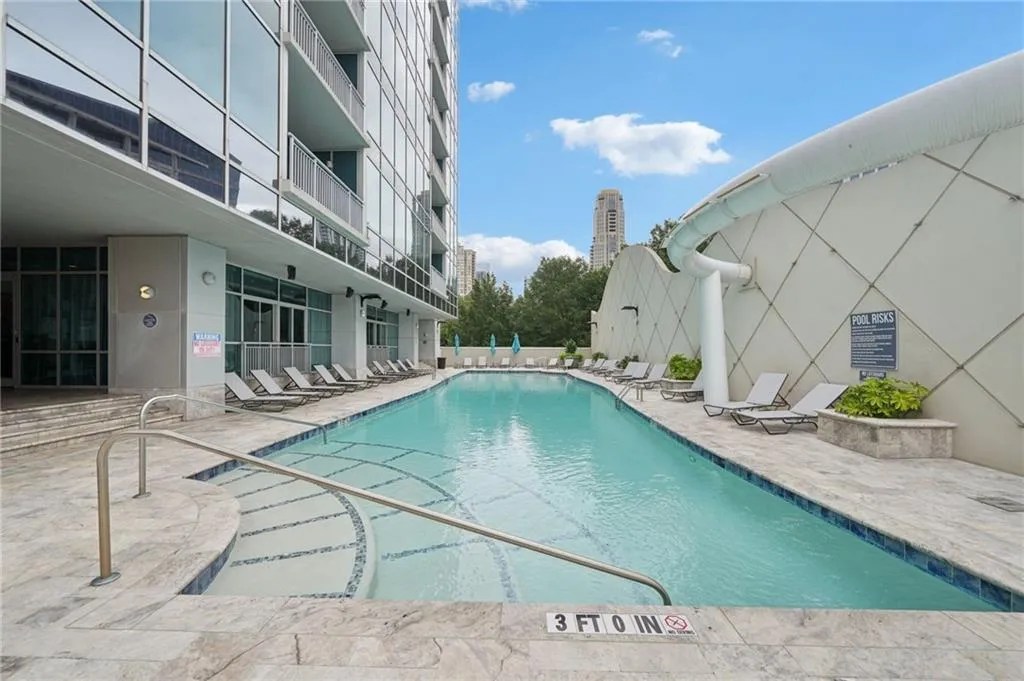 Community pool with a patio area