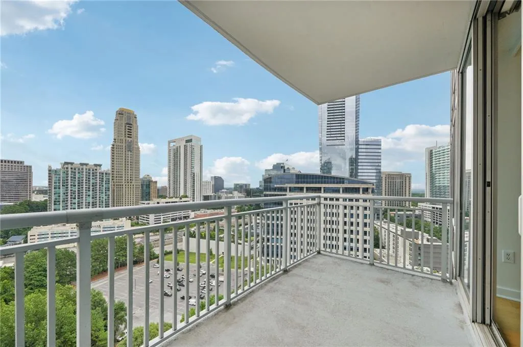 Balcony featuring a skyline view