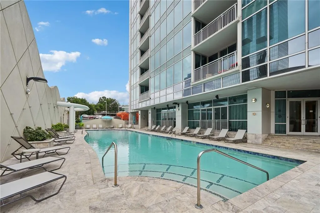 Community pool with a patio