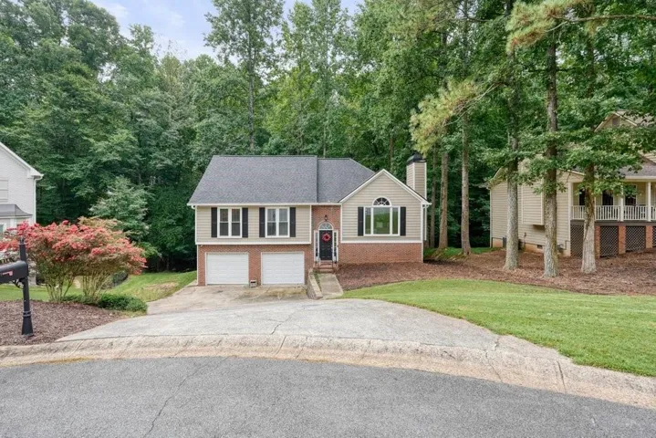 Brick and siding exterior with a two-car garage