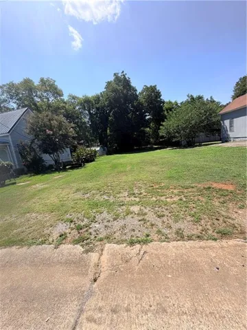 Expansive green space with mature trees