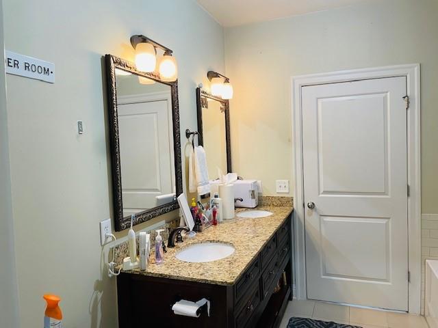 Bathroom with vanity and tile flooring