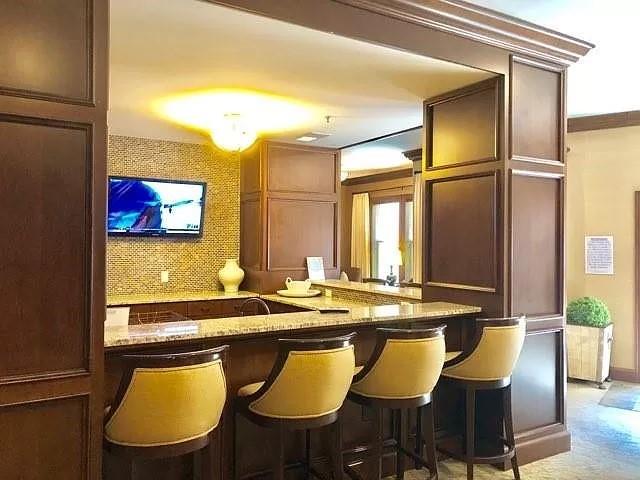 Bar with light stone countertops