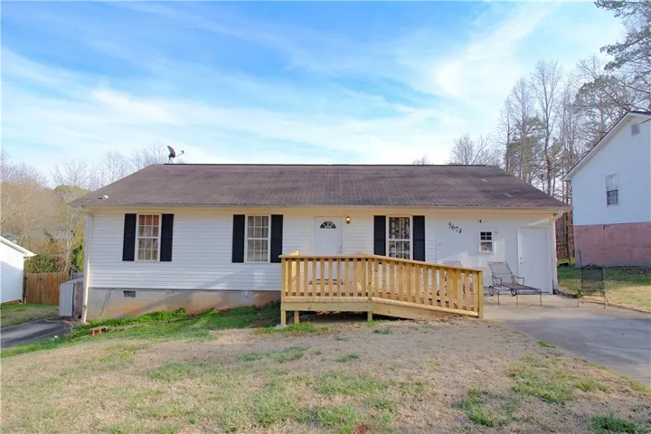 Ranch-style house featuring crawl space and a wooden deck