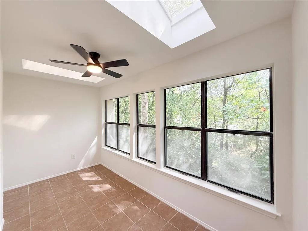 Top floor unit provides high ceilings