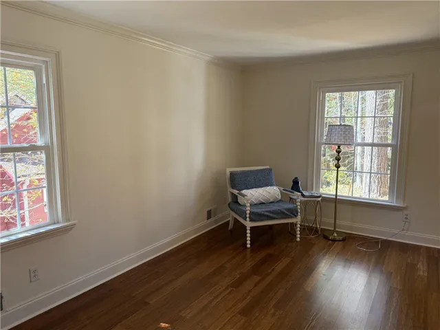 Hardwood-finish flooring throughout, complemented by crisp white trim