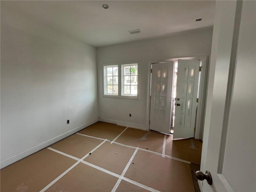 The upstairs secondary bedroom has hardwood floors and ensuite bath.