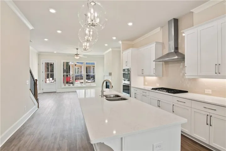 Anchored by a generous island, the kitchen blends style and functionality, offering plenty of space for cooking, serving, and socializing. Photos not of actual home, but previous built Hillsdale.