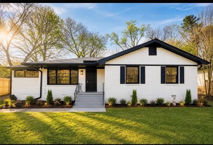 White painted brick exterior with black trim accents
