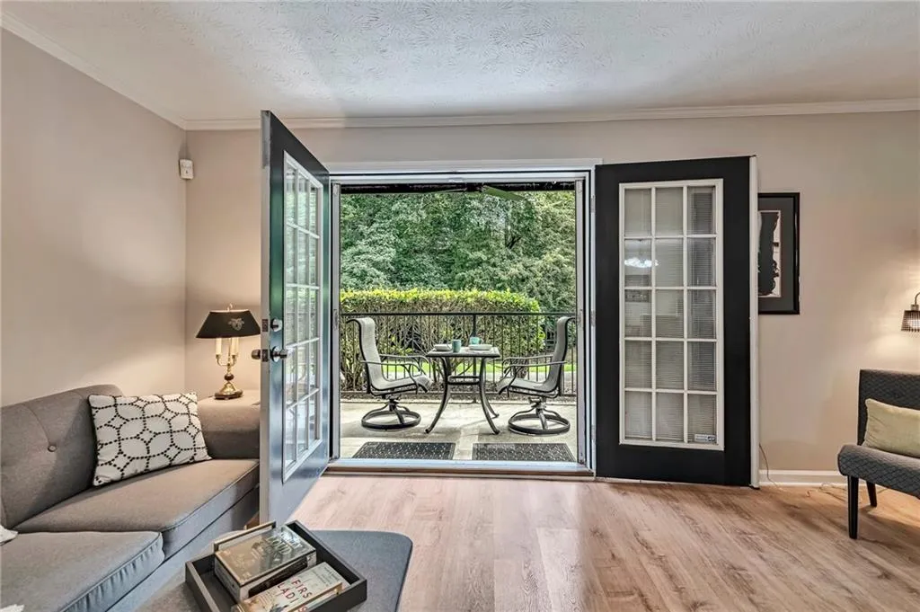 Step out of Living Room into a Nature-Surrounded Patio showing Bistro Set for Morning Coffee, Evening Cocktails and Relaxing Weekend Meals.
