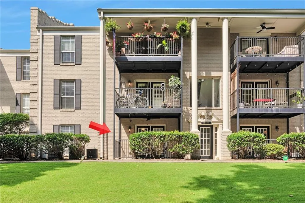Building Rear Exterior --  Arrow shows location of unit.