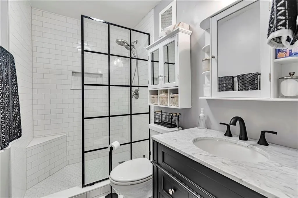 Recently updated, Full Bath featuring a stall shower and vanity.  Plenty of room for storage.
