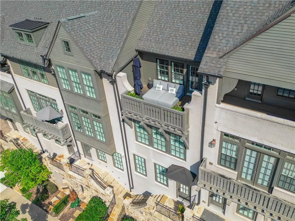 Absolutely Stunning 4 Story Luxury Townhome With All The Bells and Whistles Including A Private Interior Elevator, 2 Car Garage and Professional Designer Selections and Finishes at Every Turn.  This Beauty Fronts the Park and Pools and Has Stellar Views!