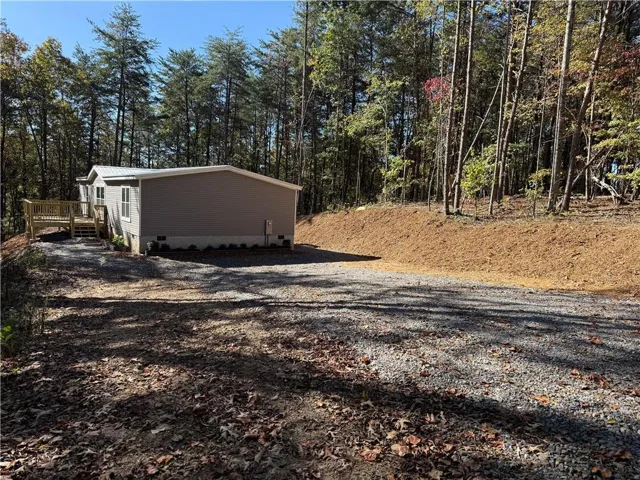 Parking area and driveway leading to fabulous view of 2 plus acres and beautiful surroundings of brand new ranch home