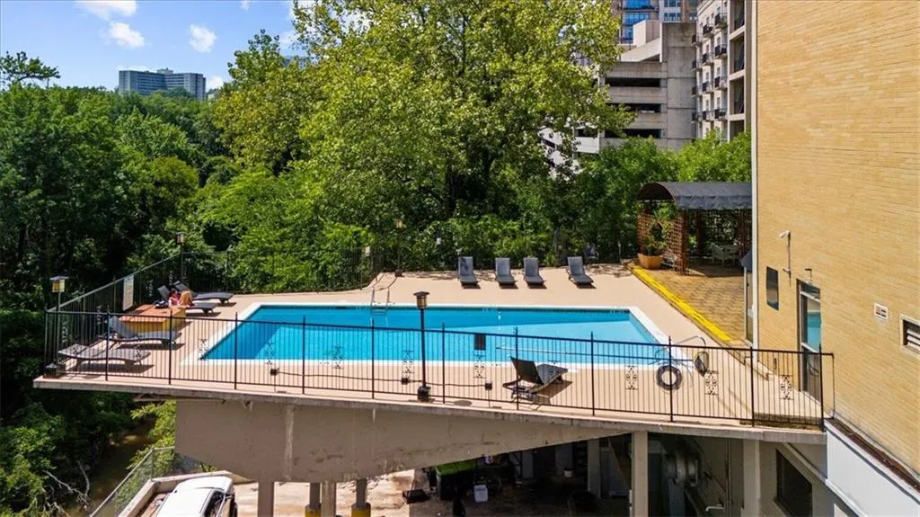 Community pool featuring a patio