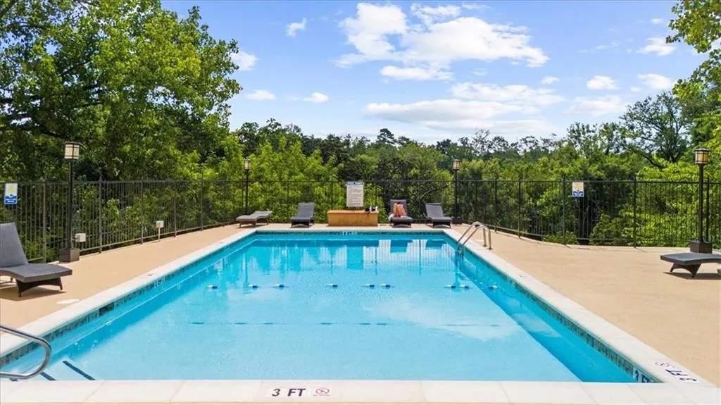 Community pool with a patio
